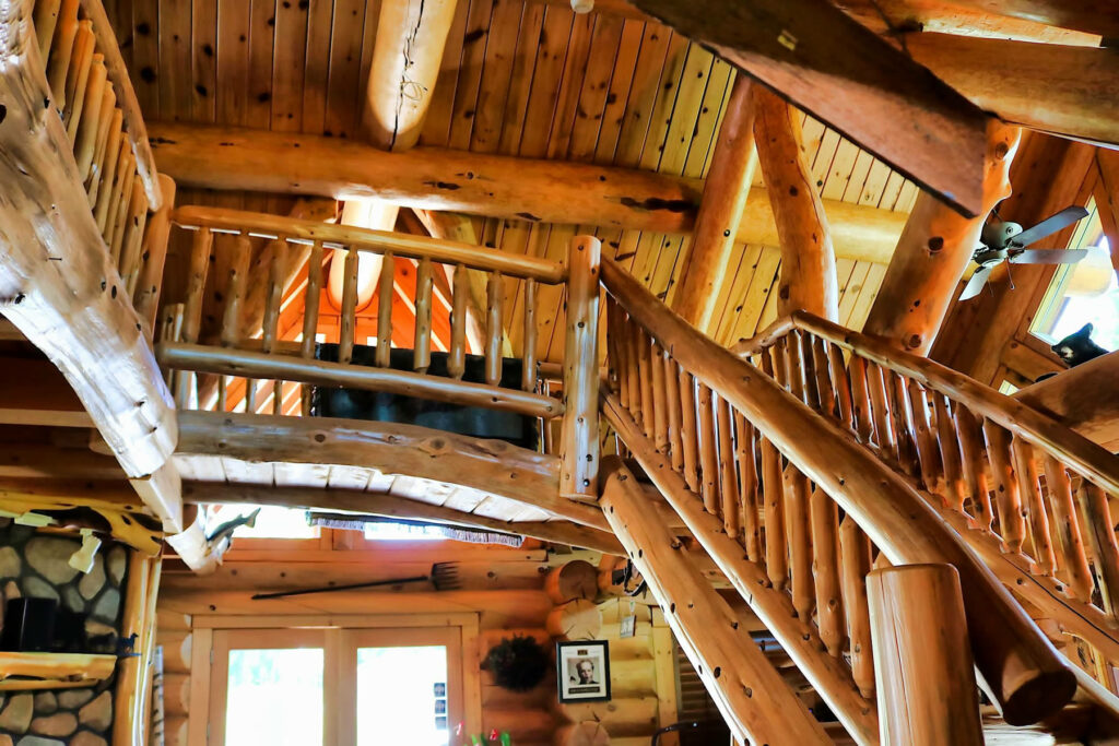 Yellowstone Log Homes custom beams and staircase located in the McGregor office 4398
