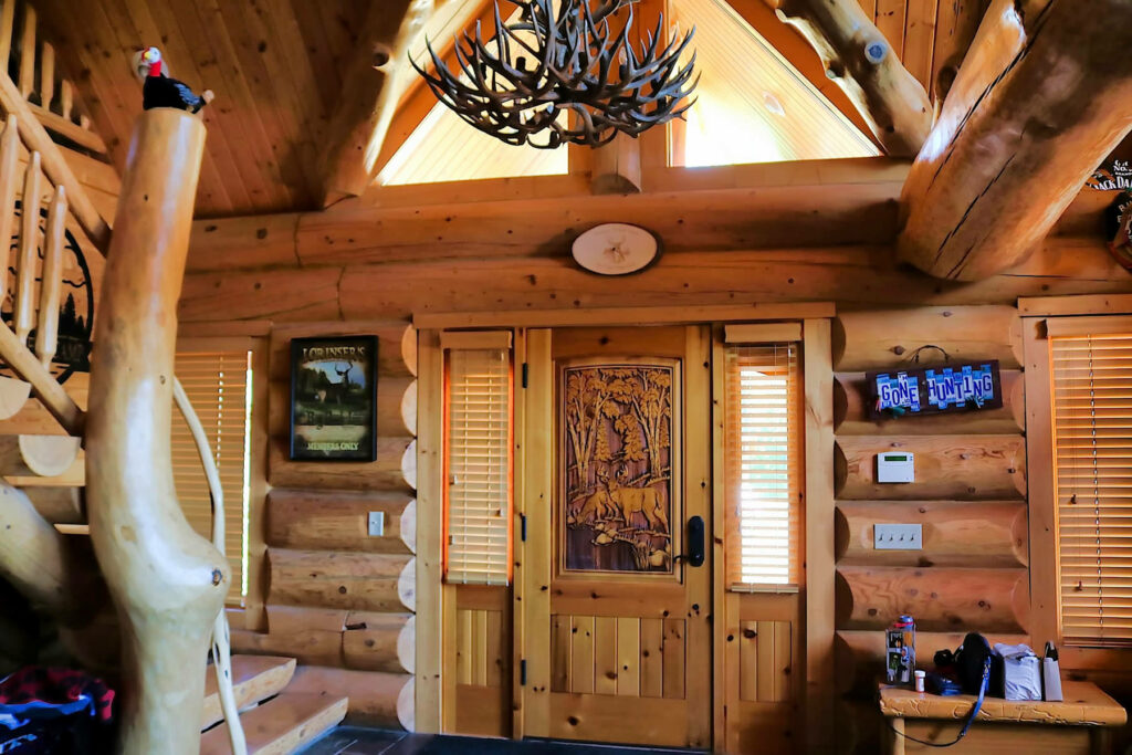 Yellowstone Log Homes inside entry way on main floor at Mcgregor Log Home 4466