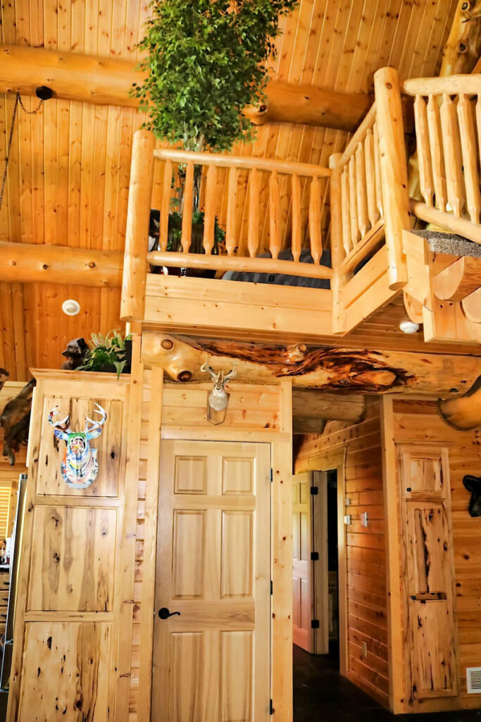 Yellowstone Log Homes loft view from main floor at Mcgregor Log Home 4462
