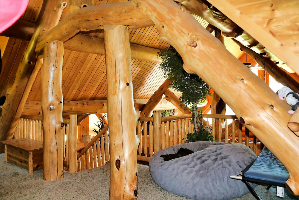 Yellowstone Log Homes loft with beams at Mcgregor Log Home 4451