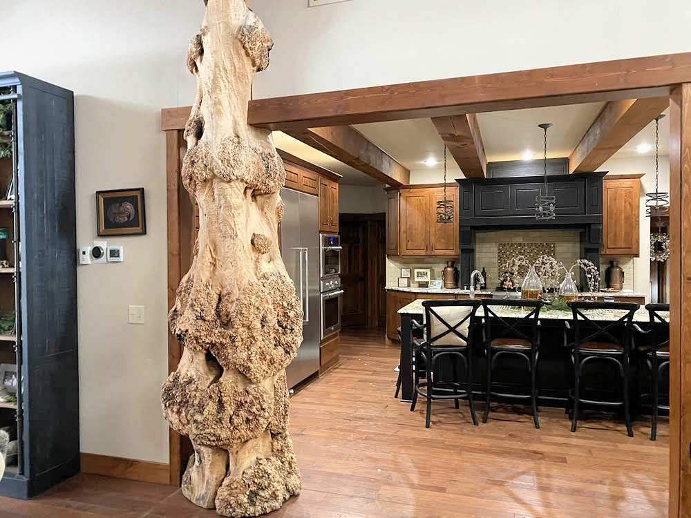 yellowstone-log-homes-interior-design-elements-log-tower-in-living-room-4